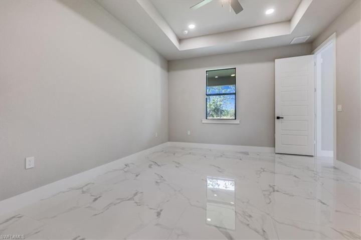 Stunning tray ceilings in master.