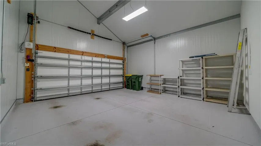 Enormous garage, super high ceiling,  steel walls & hurricane rated door.