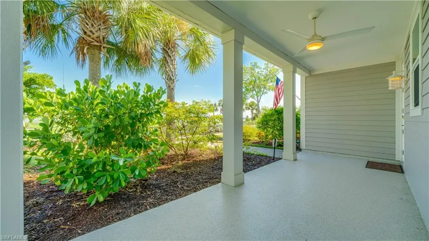 Large front porch with ceiling fan.