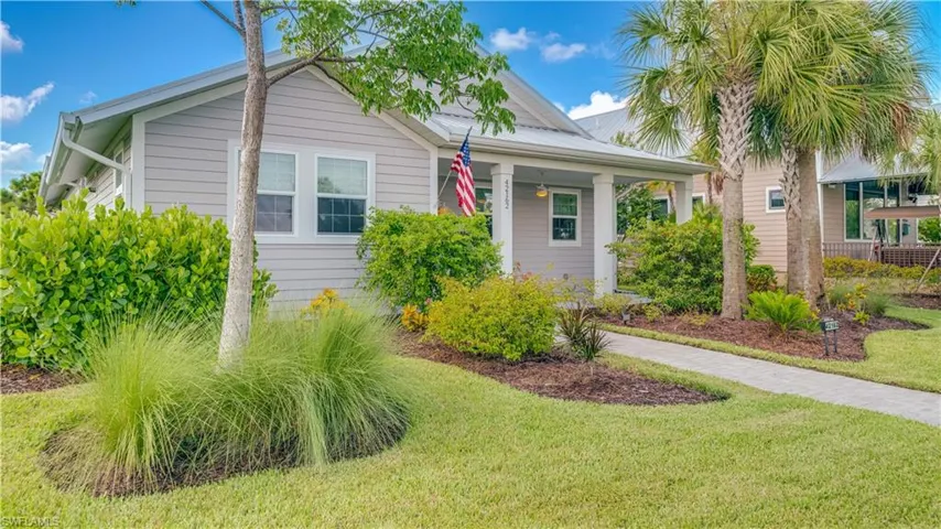 View of the front of the property featuring professional landscaping.