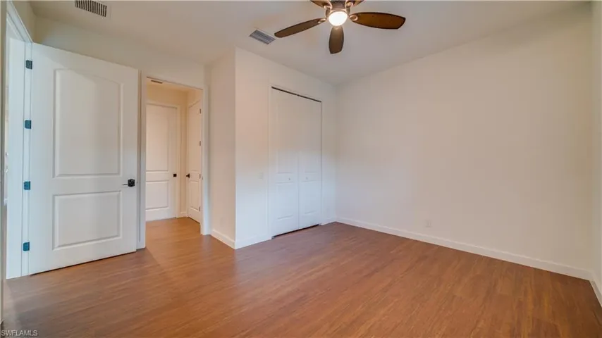 Guest bedroom #2 has a large closet with closet system.