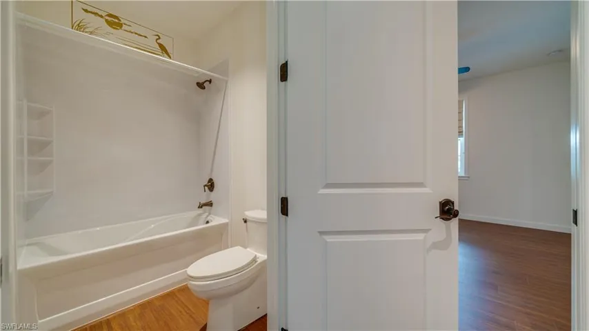 Guest Bathroom featuring shower / bathing tub combination.