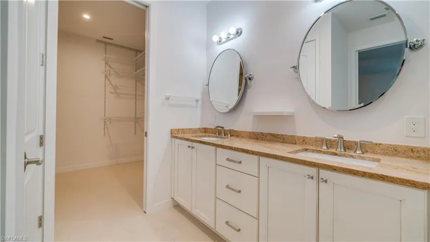 Entrance to the walk-in closet with shelving system.
