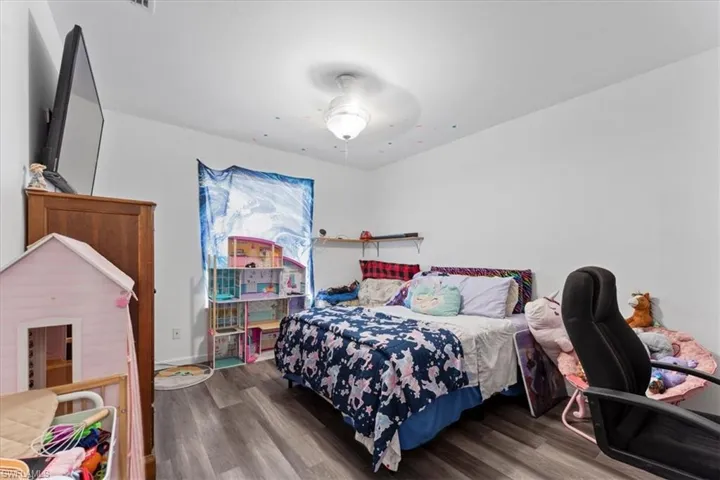 Bedroom with wood finished floors