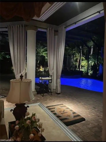 View of patio / terrace featuring a lanai