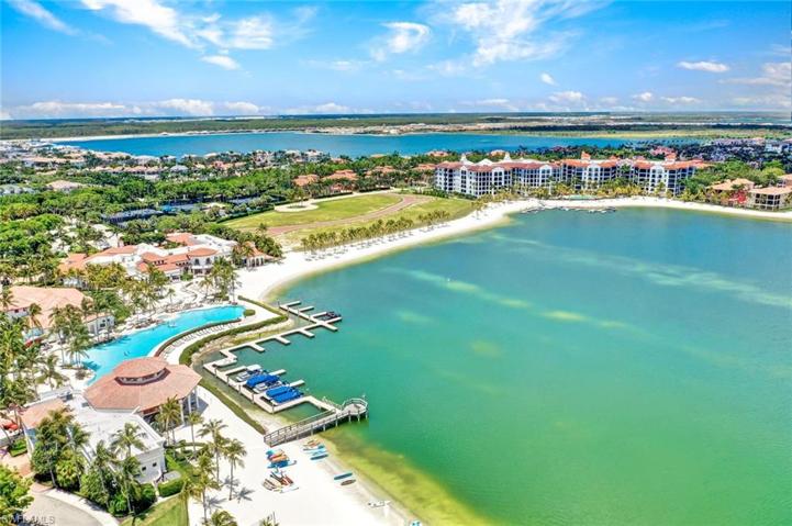 Aerial view of Small lake, beaches, amenity area and Mirasol in backround