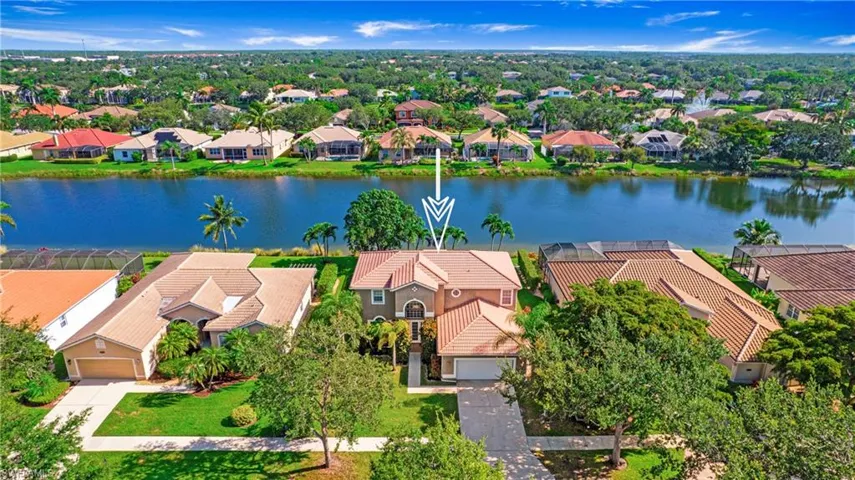 Aerial view of residential area with a large body of water