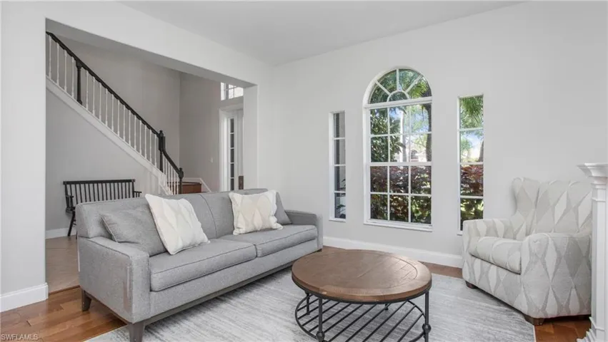 Living area featuring wood finished floors and stairway