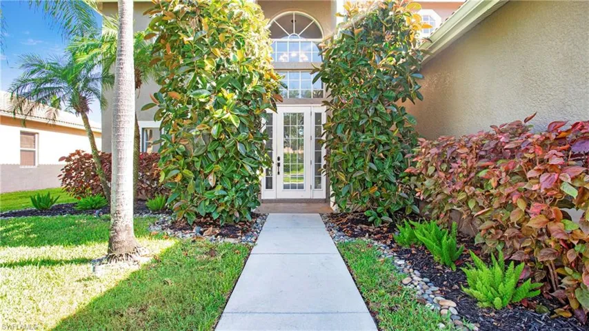View of exterior entry featuring stucco siding