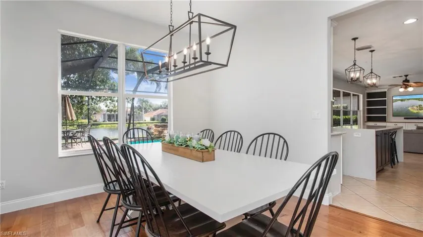 Dining room with healthy amount of natural light, light wood-type flooring, recessed lighting, and a ceiling fan