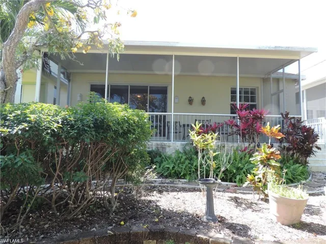 Rear view of house with covered porch