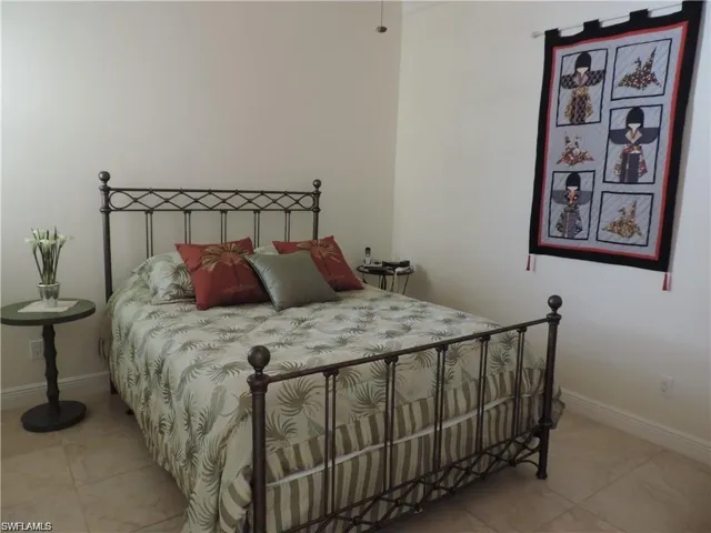 Bedroom featuring tile floors