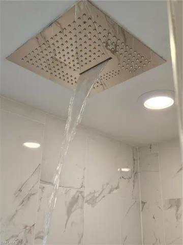 Bathroom view of a marble finish shower