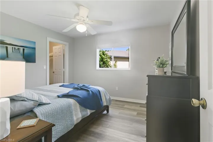 Bedroom featuring wood finished floors and ceiling fan