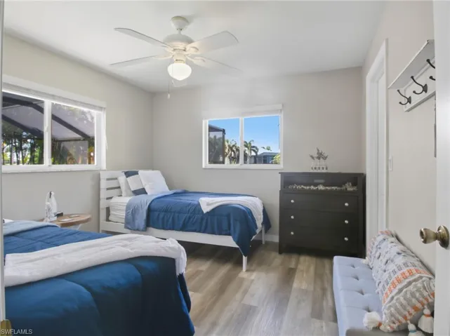 Bedroom featuring wood finished floors and a ceiling fan
