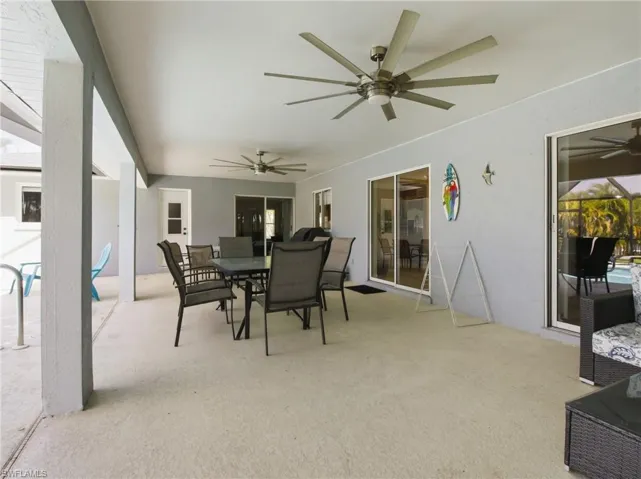 View of patio / terrace featuring outdoor dining space and a ceiling fan