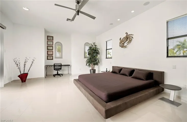 Guest Bedroom featuring recessed lighting and       a ceiling fan as well access to a balcony facing front of the house