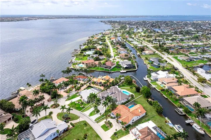 Aerial view of residential area featuring a large body of water