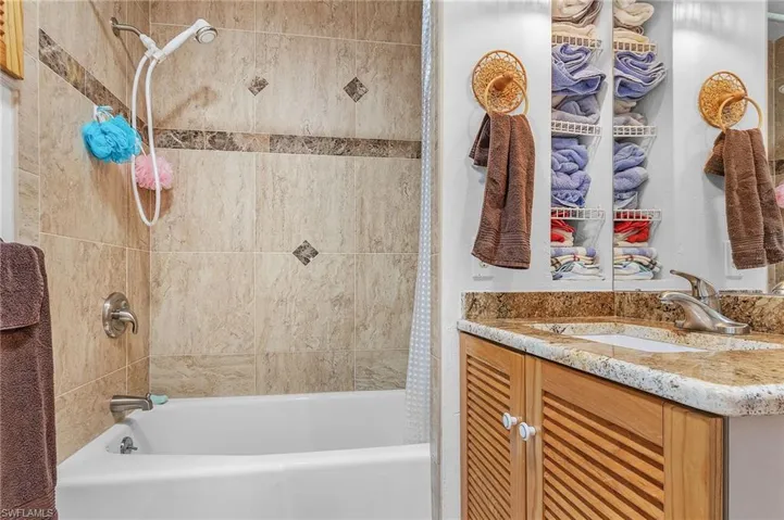 Bathroom featuring vanity and shower / bath combo