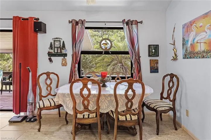 Dining space with tile patterned floors
