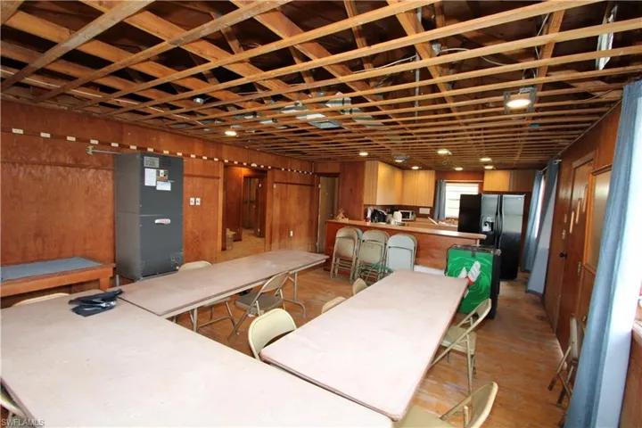 Living room featuring wooden walls