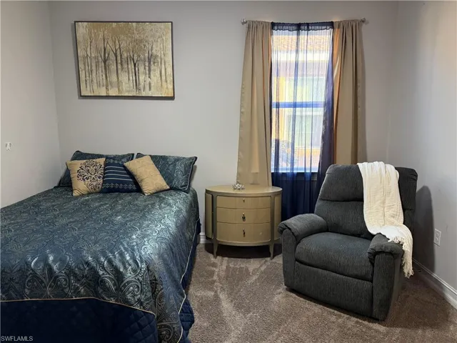 Bedroom featuring carpet,guest room with bathroom