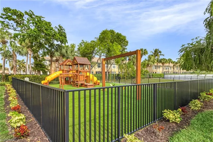 View of playground featuring a yard