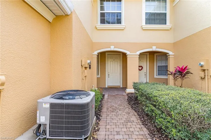Entrance to property with central air condition unit