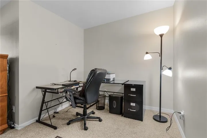 Office space featuring light carpet