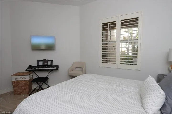 Bedroom with tile patterned floors