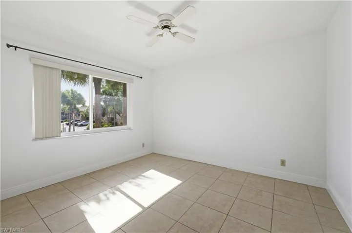 Room featuring tile flooring and a ceiling fan