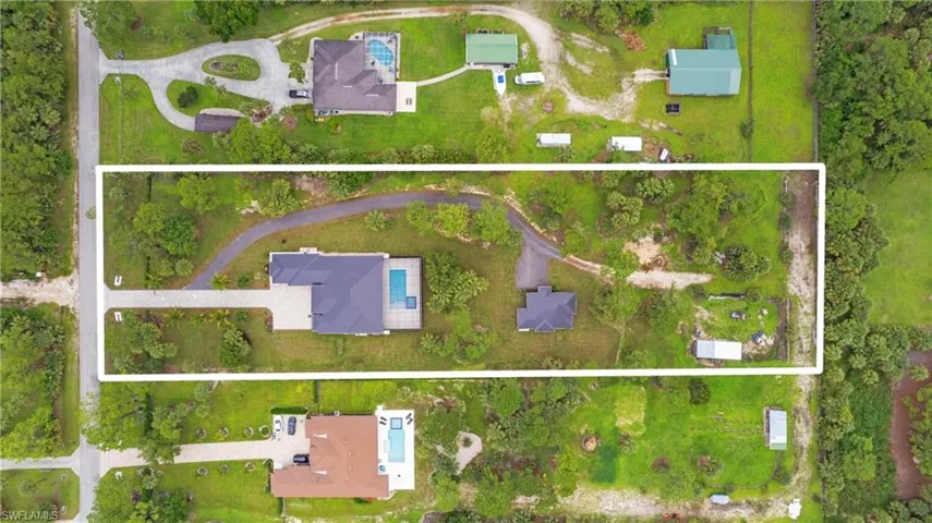 Aerial overview of property's location with property parcel outlined