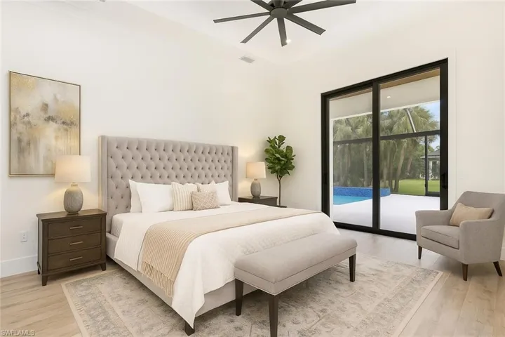 Bedroom with light wood-style flooring, access to exterior, and a ceiling fan