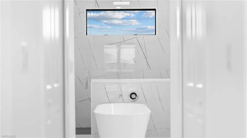 Bathroom featuring a washtub