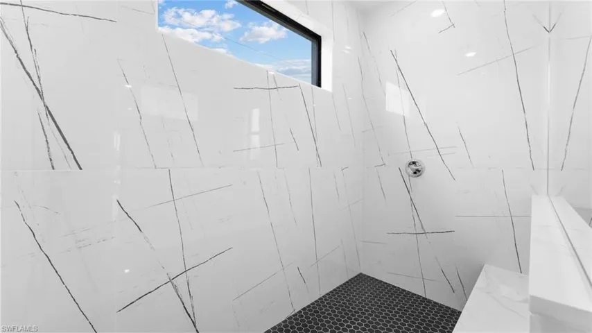 Bathroom with a tile shower