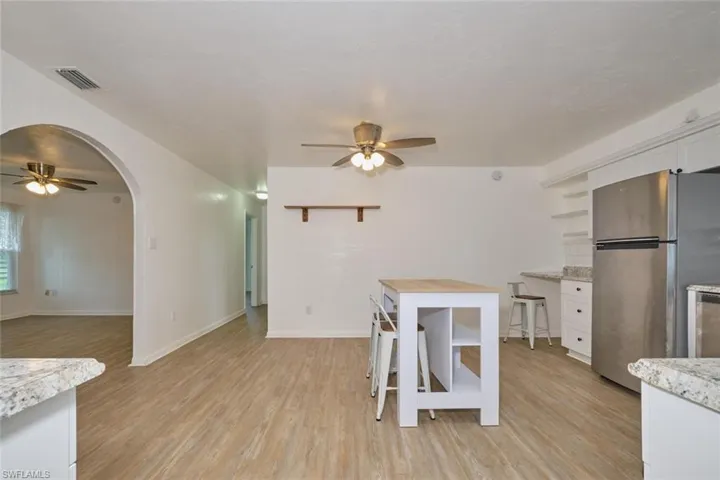 Dining area featuring light wood-type flooring and ceiling fan