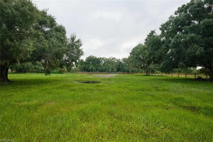 View of yard with a rural view