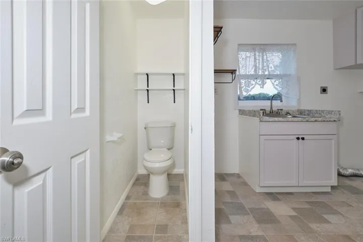 Bathroom with vanity and toilet