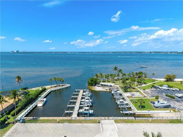 Drone / aerial view of a nearby body of water and numerous boat docks
