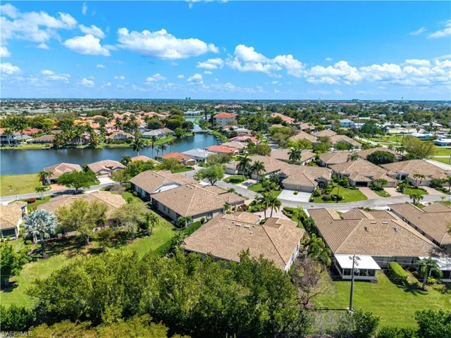 Aerial perspective of suburban area with a large body of water