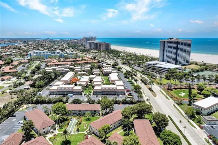 Drone / aerial view with a beach view and a water view