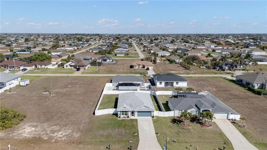 Aerial overview of property's location featuring nearby suburban area
