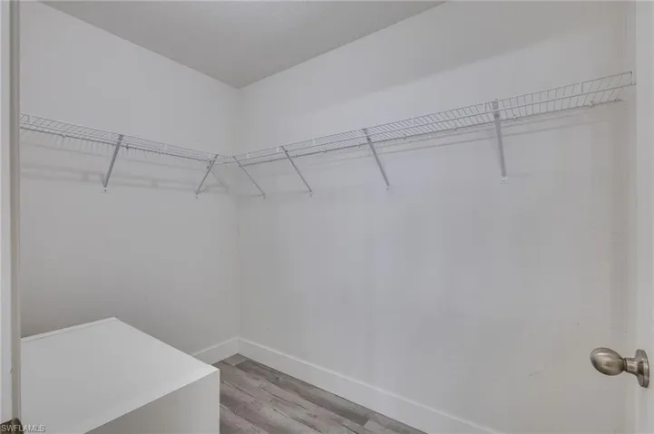 Walk in closet featuring light wood-type flooring