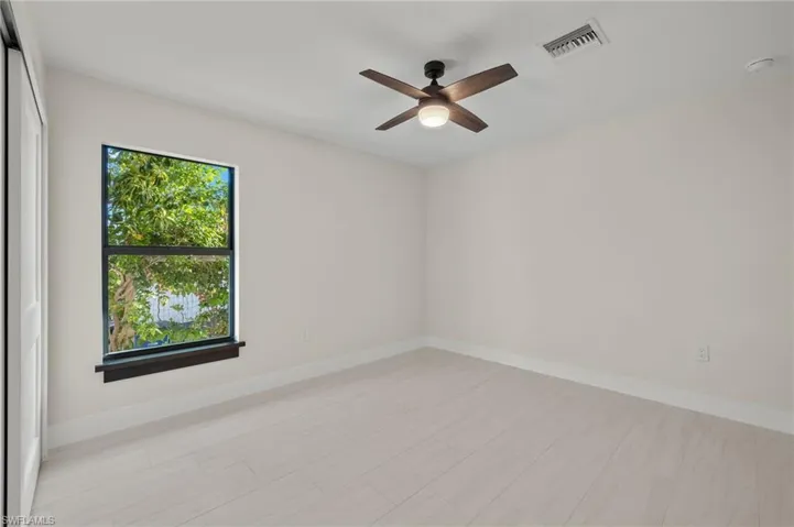 Spare room with ceiling fan