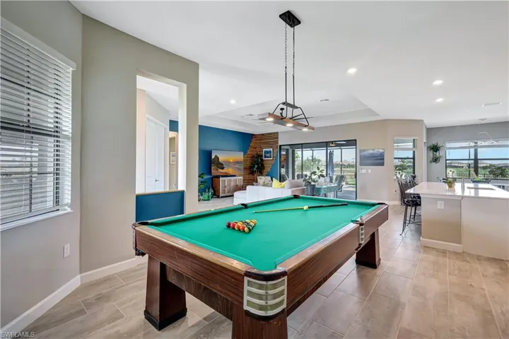 Game room featuring a tray ceiling, baseboards, billiards, and recessed lighting