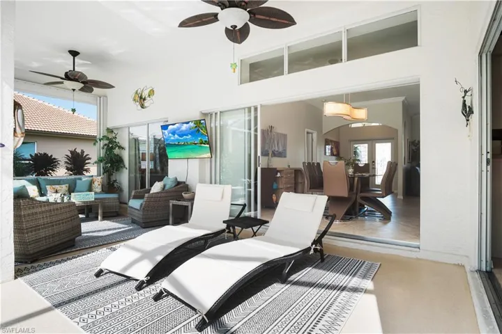 View of patio featuring an outdoor living space and ceiling fan