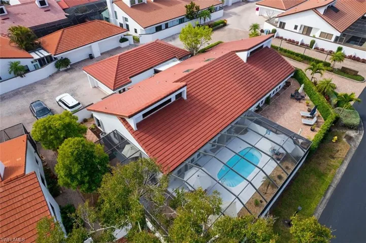 Aerial perspective of suburban area featuring a pool area