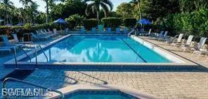 Community pool with a patio area
