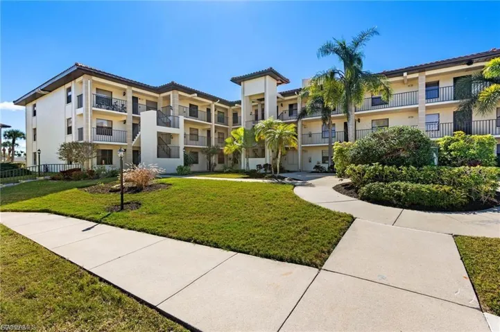 View of property's community with a lawn