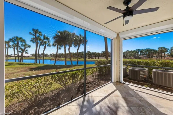 Unfurnished sunroom featuring a water view